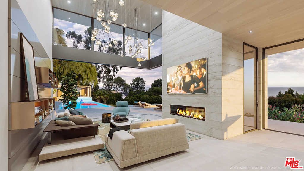 Great room with linear fireplace and pool view