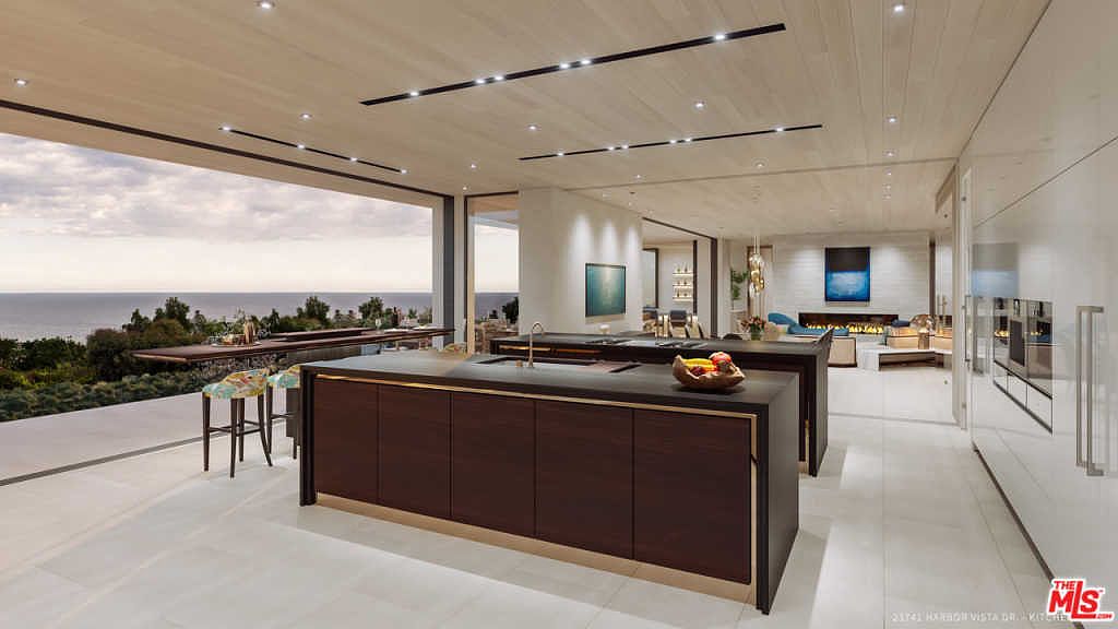 Ocean-view kitchen with pocketing sliders open to the bluff